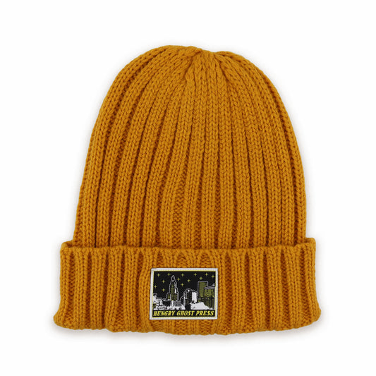The Sleepy City Woven Patch Cable Knit Beanie