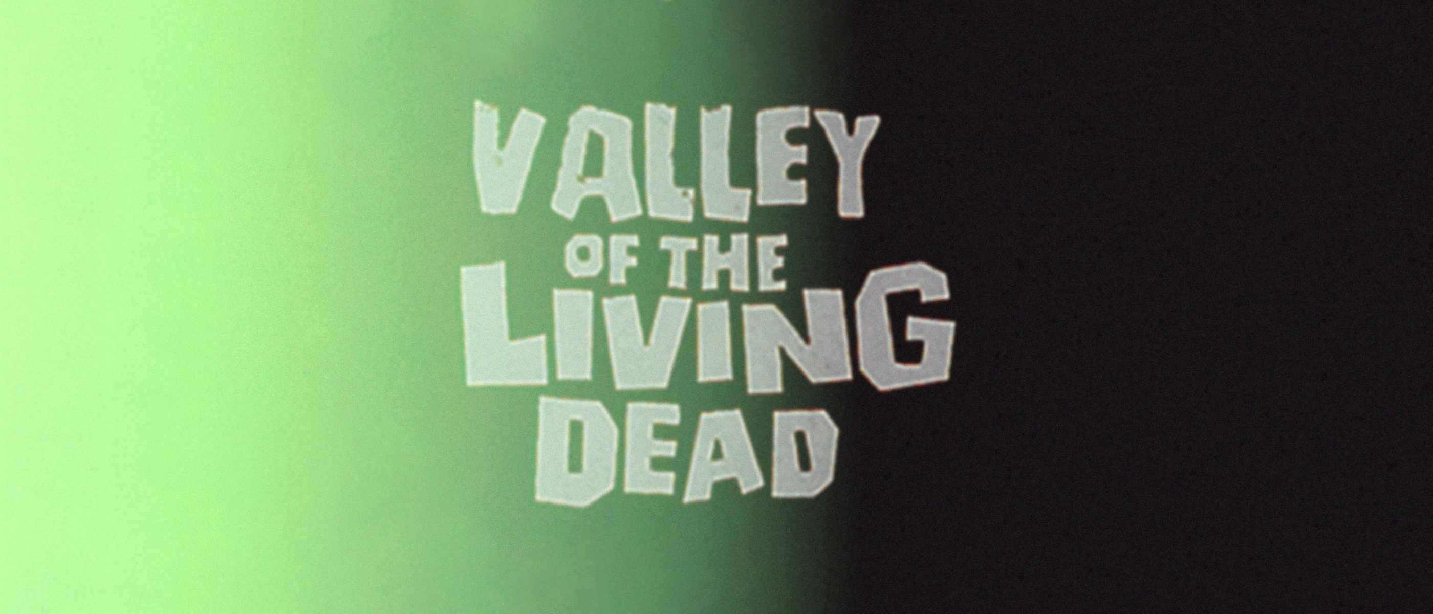 Text 'Valley of the Living Dead' on a gradient background from green to black with smaller text for banner