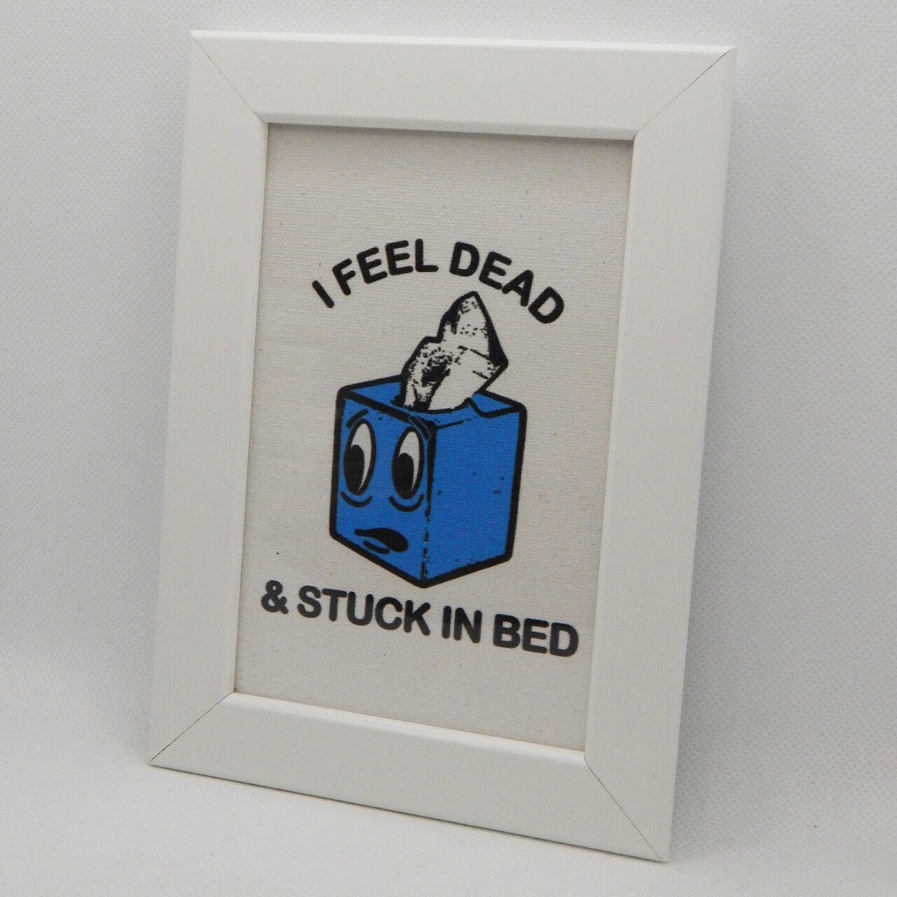 Stuck in Bed Framed Canvas Print